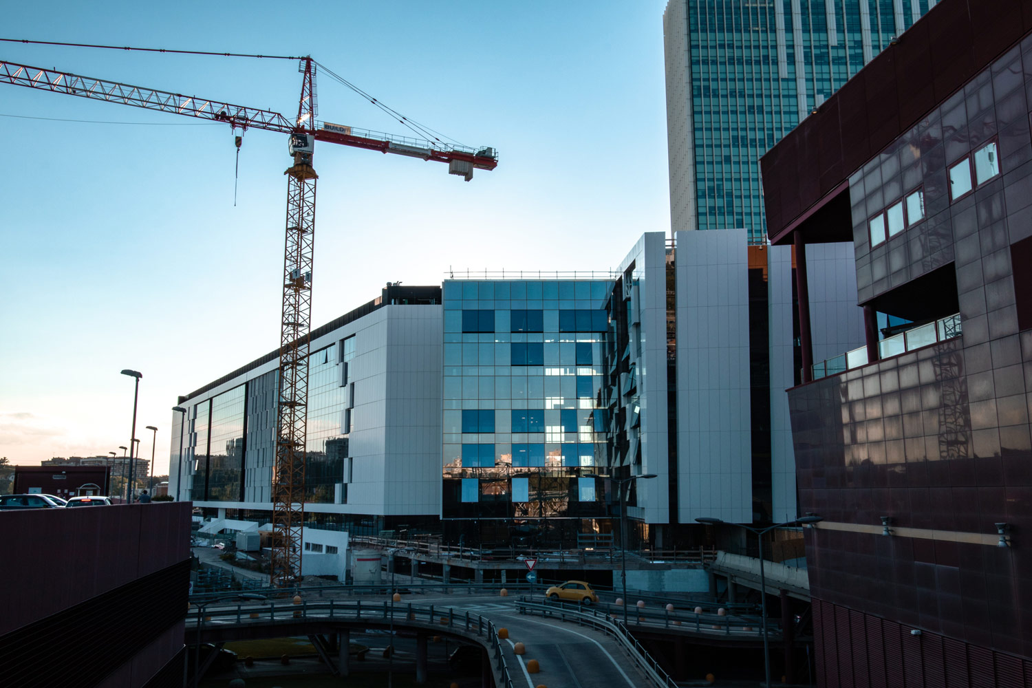 Commercial crane next to buildings